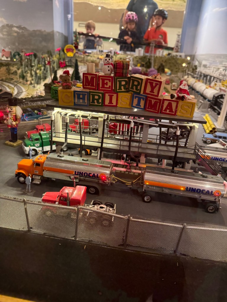 Merry Christmas holiday decorations on a layout at the San Diego Model Railroad Museum