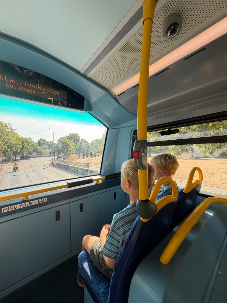 Kids riding the Tube in London with kids